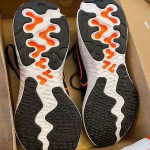 Nike running shoes. Orange. Never worn.